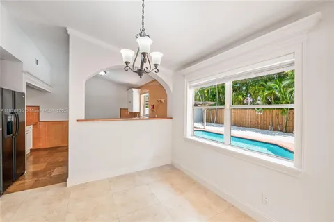 a view of livingroom and kitchen with furniture