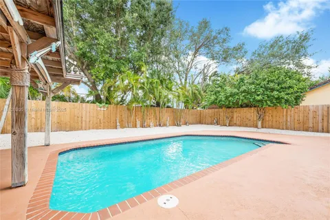 a view of a backyard with a small cabin