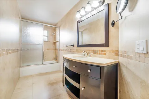 a bathroom with a sink double vanity and a mirror