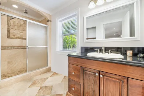 a bathroom with a sink double vanity and a mirror