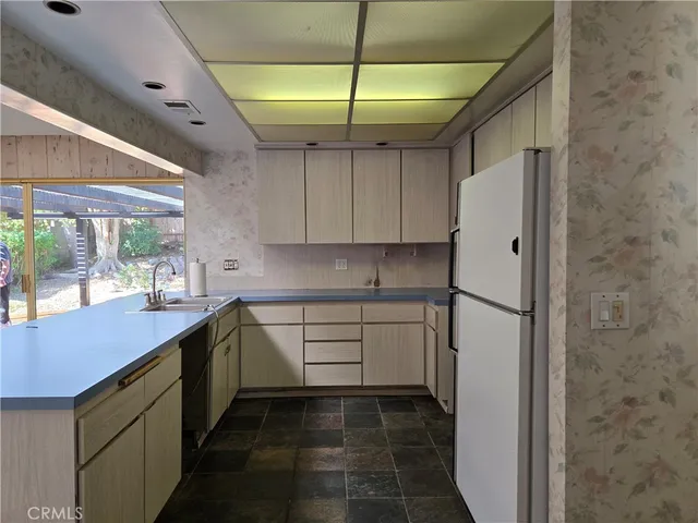 a view of a room with a bench and a window