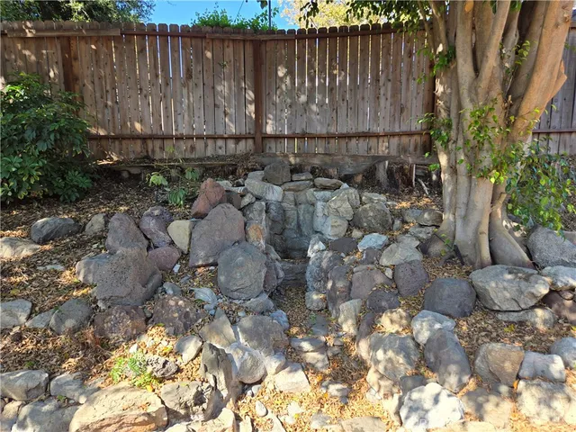 a view of a pathway both side of a house