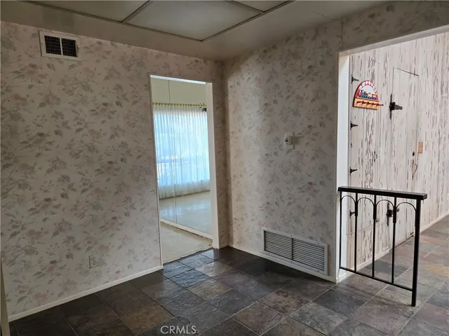 a kitchen with a refrigerator and sink
