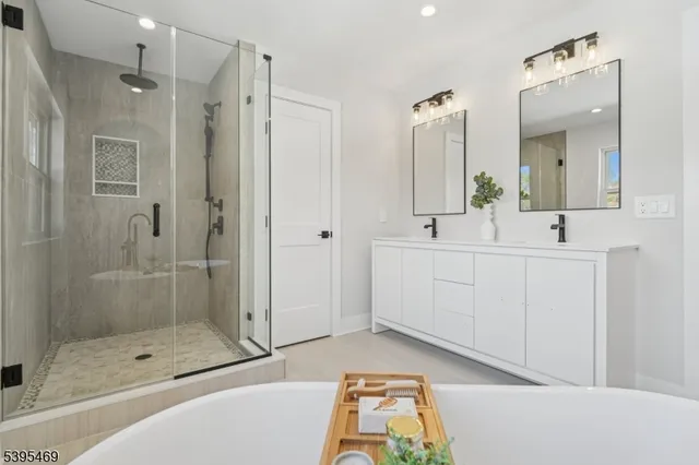 a bathroom with a shower sink and mirror