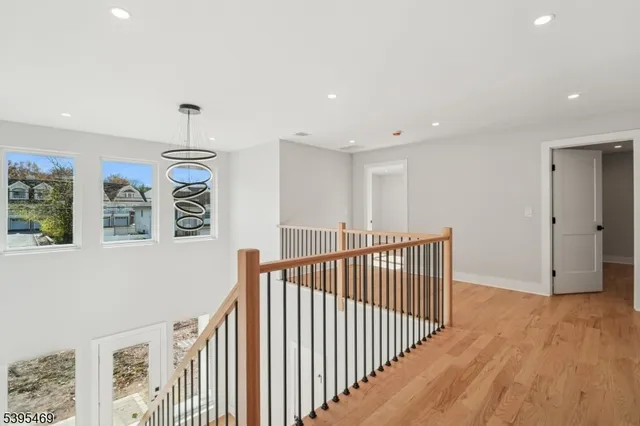 a view of hallway with wooden floor