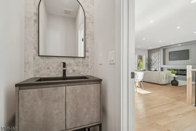 a view of living room kitchen with furniture and flat screen tv