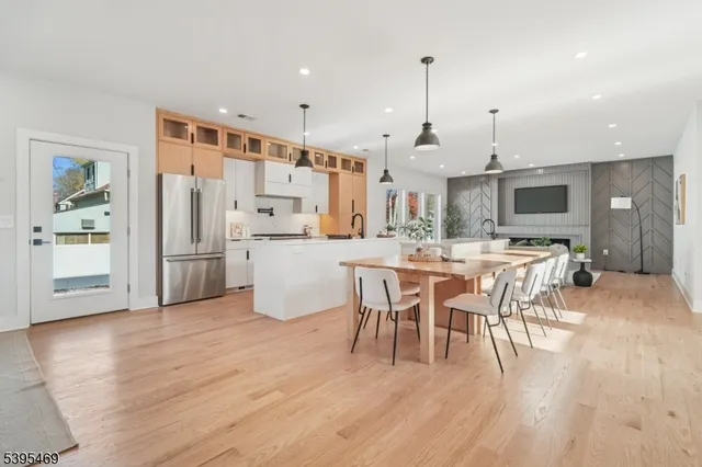 a large kitchen with a table and chairs