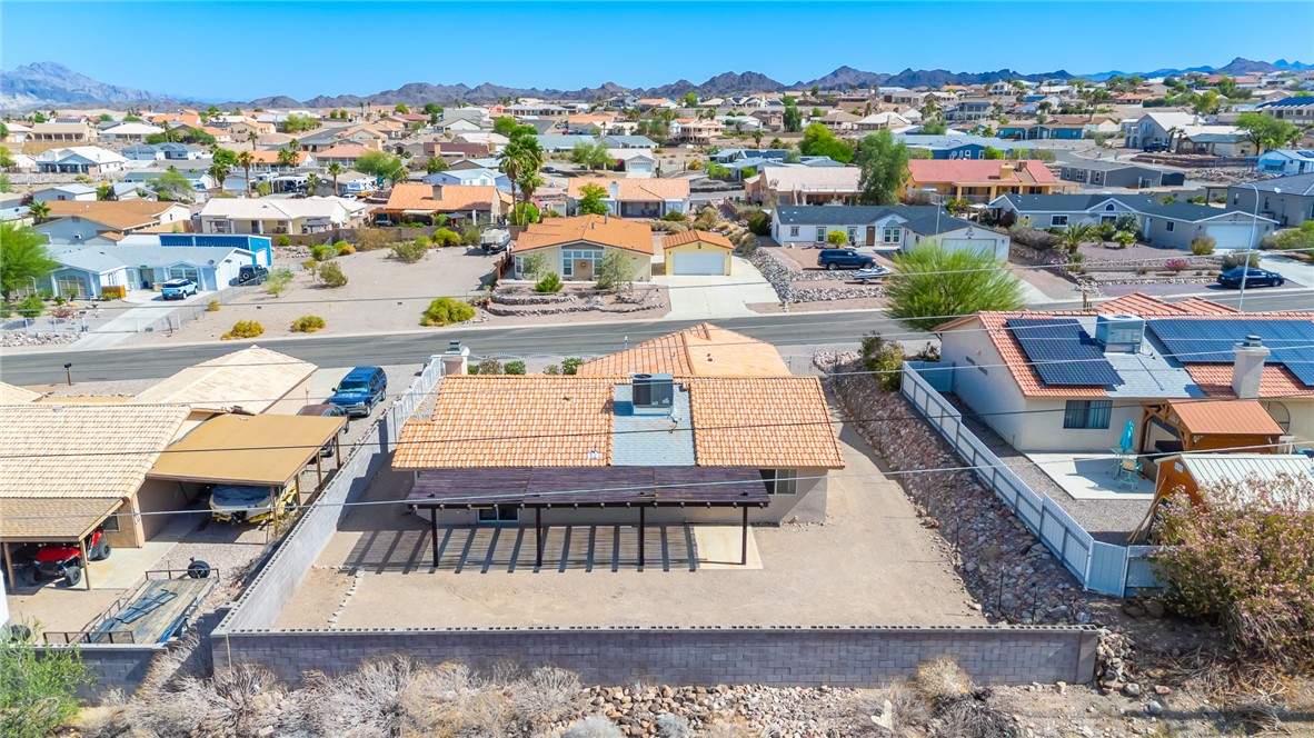 2524 South Ridge Avenue Bullhead City, AZ 86429 - Photo 59 of 64 Aerial view of residential area featuring a mountain backdrop