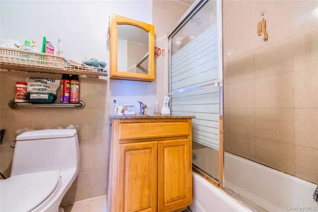 a bathroom with a sink a toilet and tub