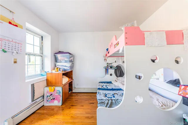 a bed room with a bed and a book shelf