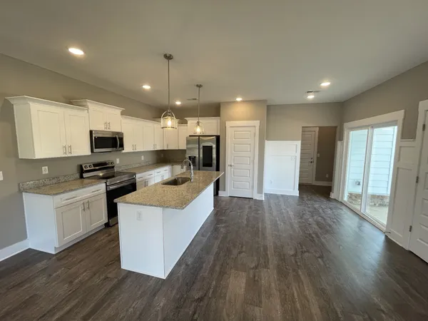 a large kitchen with cabinets