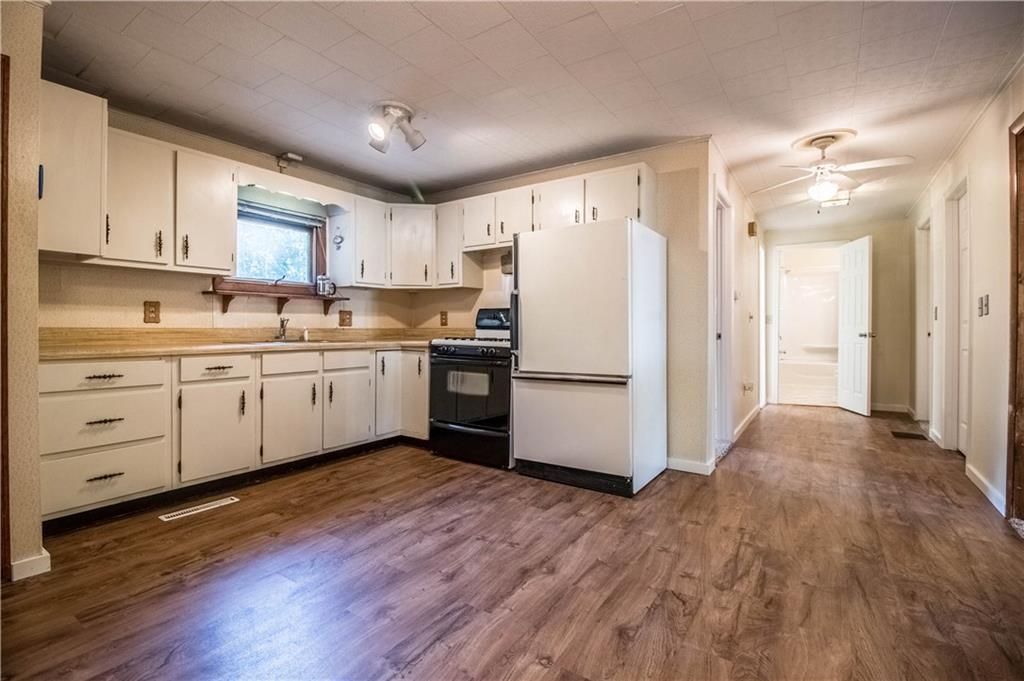402 Shaker Road Gray, ME 04039 - Photo 4 of 22 A large eat-in kitchen, gas range,...