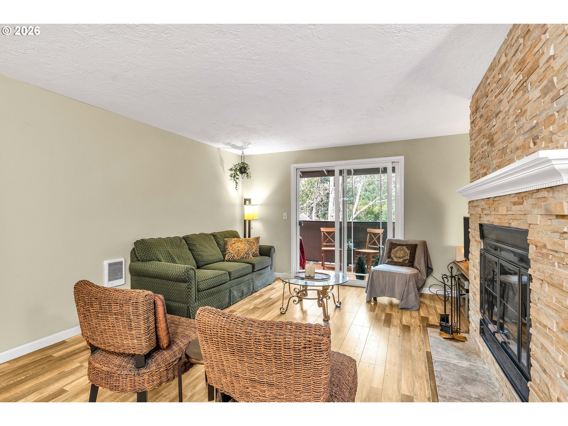 29700 Southwest Courtside Drive, Unit 36 Wilsonville, OR 97070 - Photo 11 of 40 a living room with furniture and a fireplace
