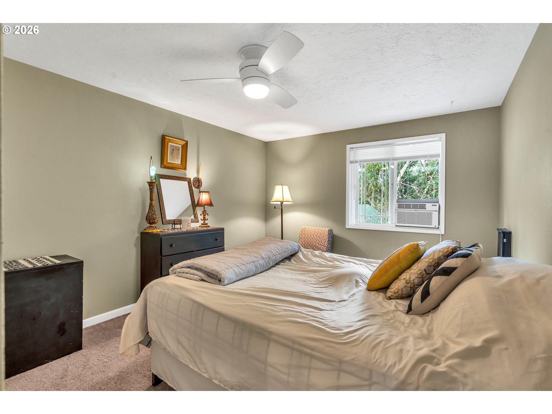 29700 Southwest Courtside Drive, Unit 36 Wilsonville, OR 97070 - Photo 21 of 40 a bedroom with a bed and a night stand