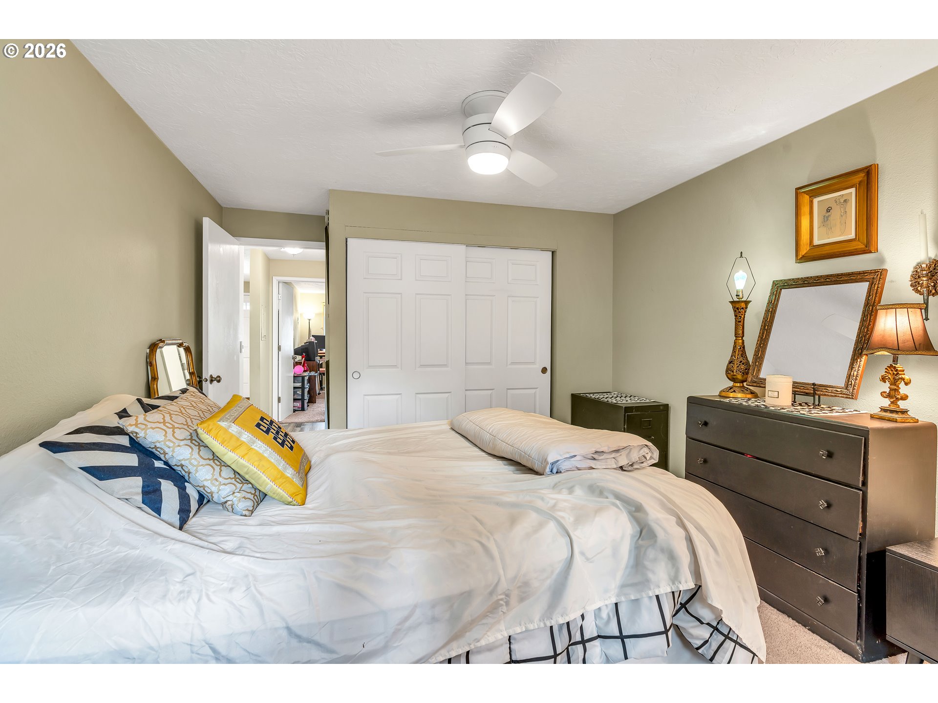 29700 Southwest Courtside Drive, Unit 36 Wilsonville, OR 97070 - Photo 23 of 40 a bedroom with a bed and a dresser