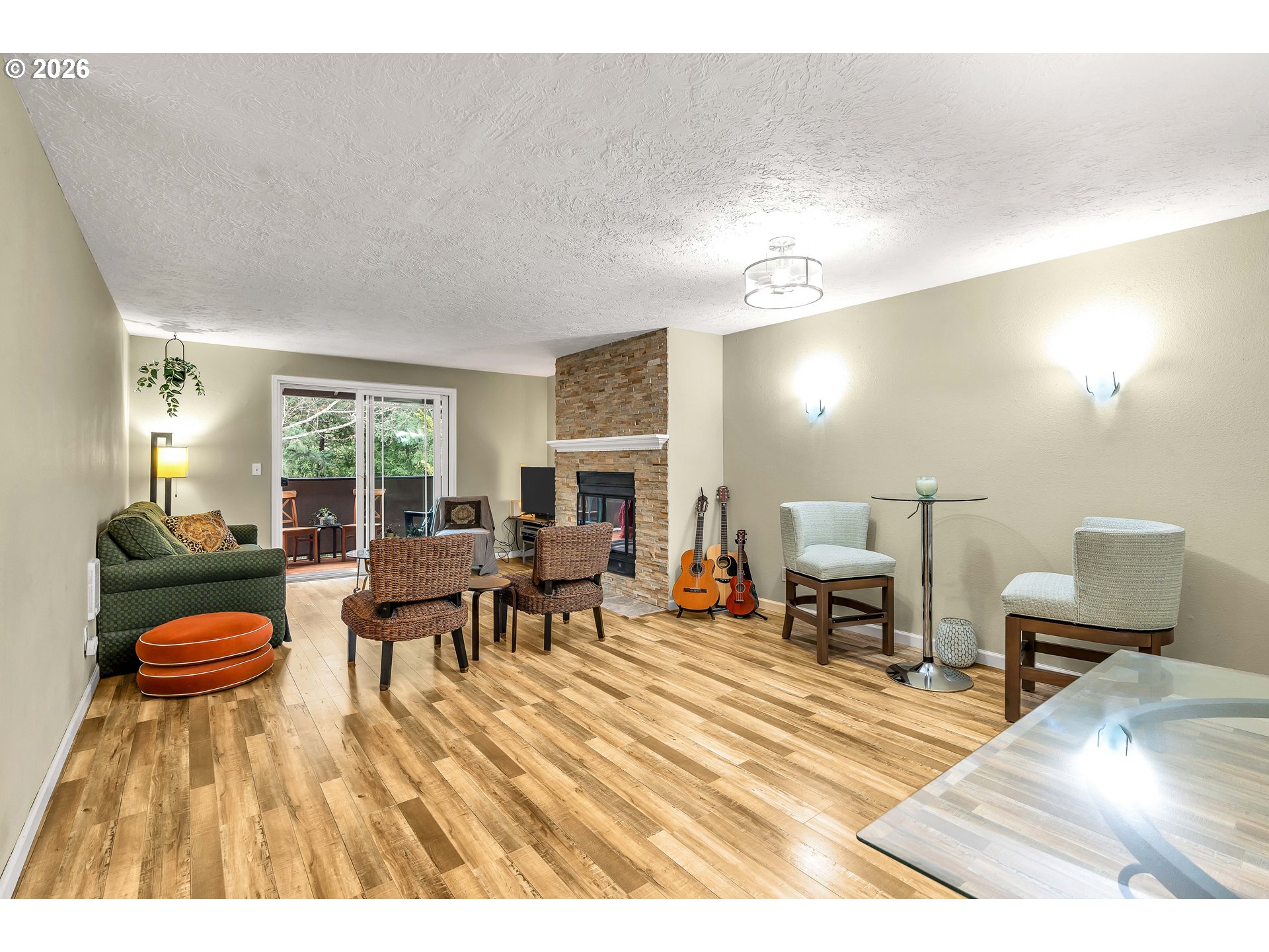 29700 Southwest Courtside Drive, Unit 36 Wilsonville, OR 97070 - Photo 10 of 40 a living room with furniture and a wooden floor