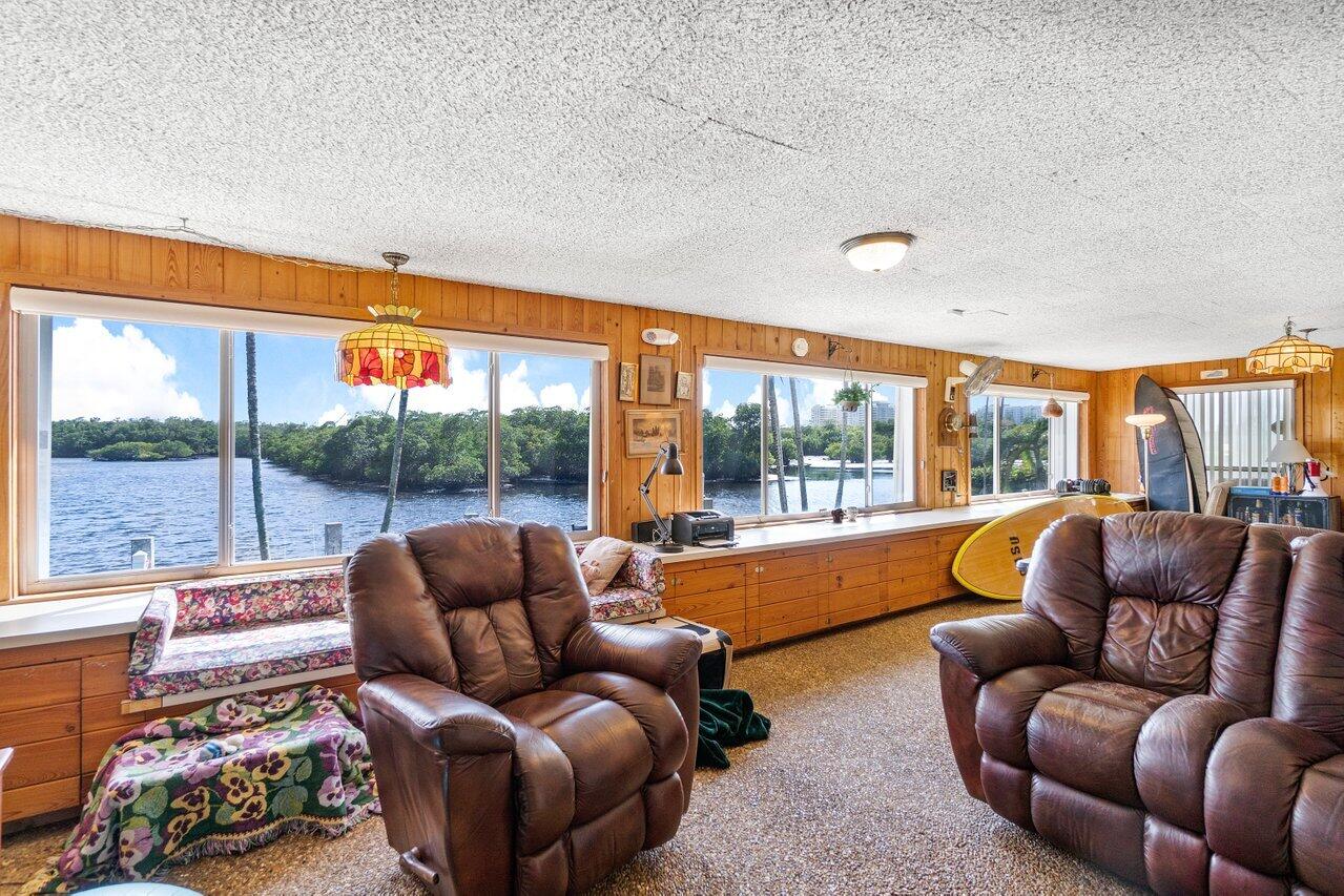 2 Inlet Cay Drive Ocean Ridge, FL 33435 - Photo 11 of 22 a living room with furniture and a large window