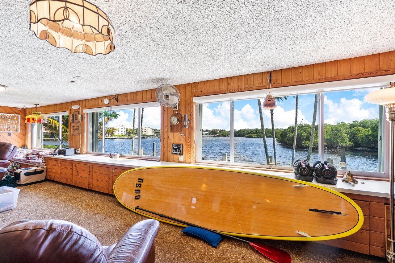 2 Inlet Cay Drive Ocean Ridge, FL 33435 - Photo 12 of 22 a room with furniture and a large window