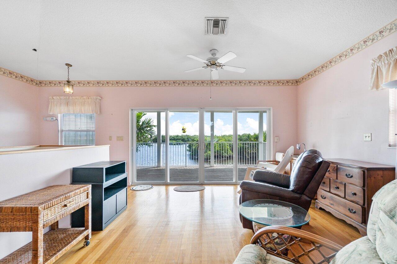 2 Inlet Cay Drive Ocean Ridge, FL 33435 - Photo 13 of 22 a living room with furniture and a large window