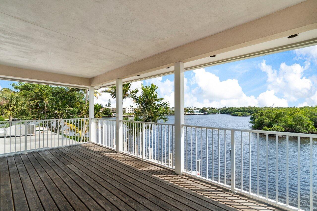 2 Inlet Cay Drive Ocean Ridge, FL 33435 - Photo 15 of 22 a view of a balcony with wooden floor