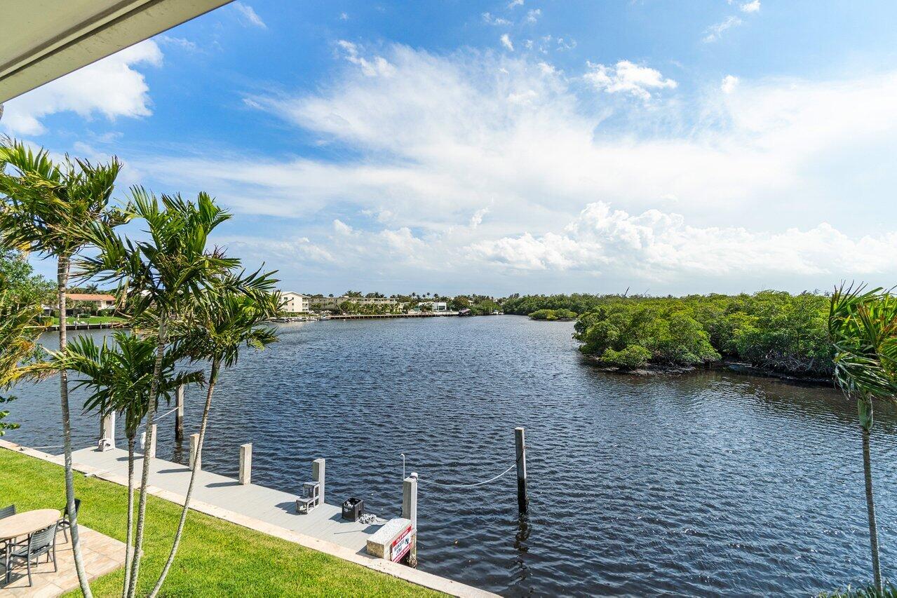 2 Inlet Cay Drive Ocean Ridge, FL 33435 - Photo 16 of 22 a view of a terrace with a garden