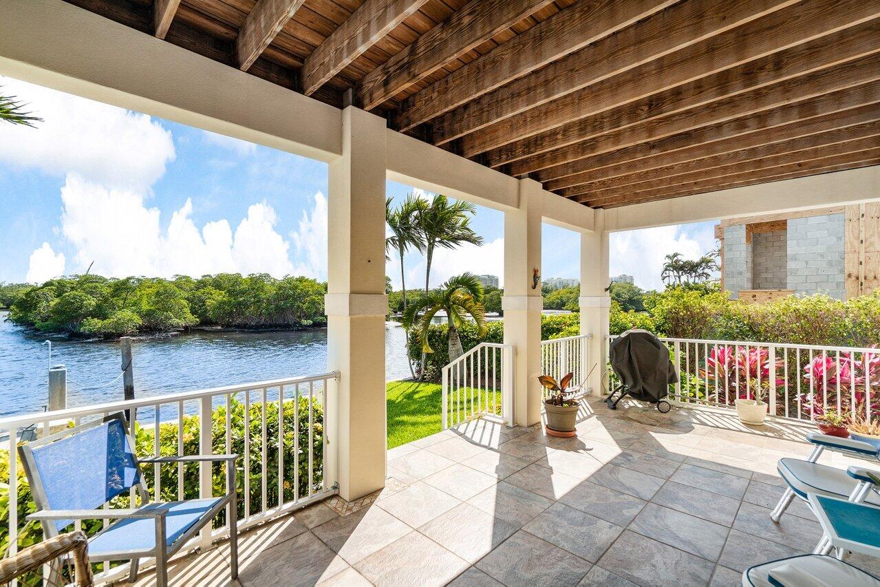 2 Inlet Cay Drive Ocean Ridge, FL 33435 - Photo 17 of 22 a view of a porch with furniture