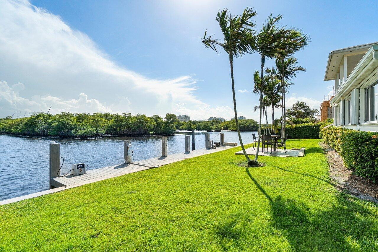 2 Inlet Cay Drive Ocean Ridge, FL 33435 - Photo 20 of 22 a view of a lake with a big yard and potted plants