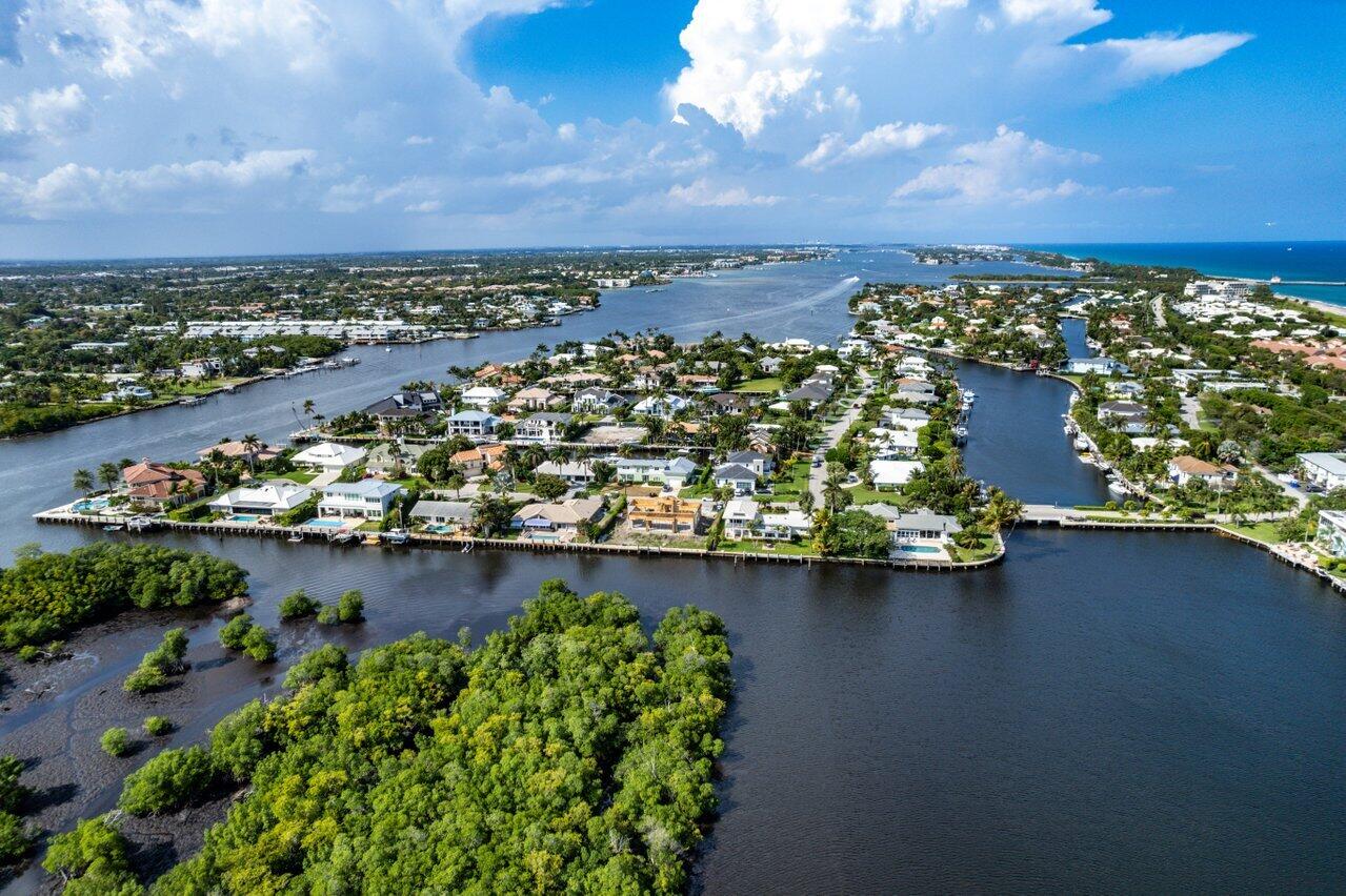 2 Inlet Cay Drive Ocean Ridge, FL 33435 - Photo 21 of 22 an aerial view of a city with lots of residential buildings ocean and mountain view in back