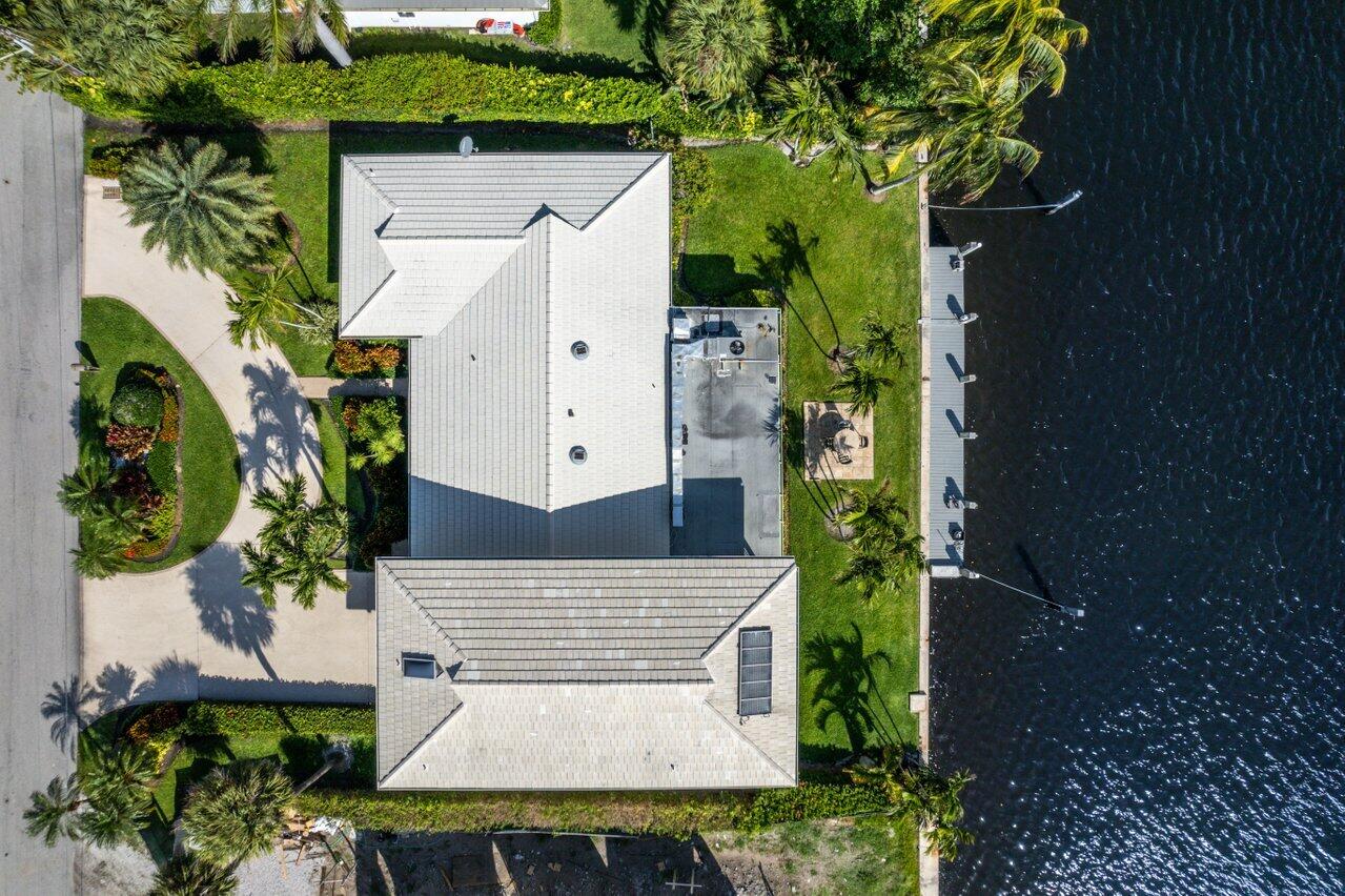 2 Inlet Cay Drive Ocean Ridge, FL 33435 - Photo 5 of 22 an aerial view of a house with a yard