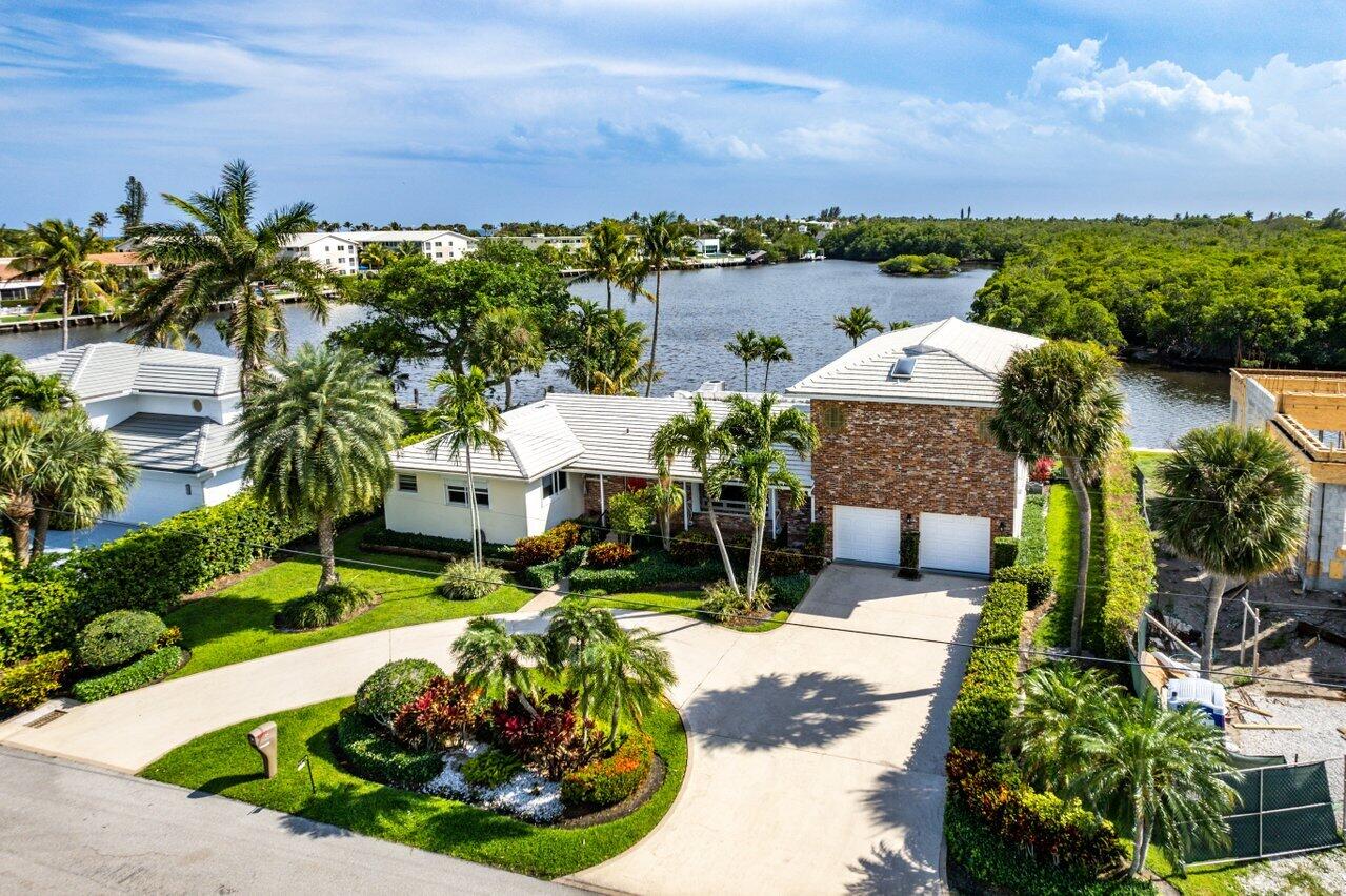 2 Inlet Cay Drive Ocean Ridge, FL 33435 - Photo 6 of 22 a view of a backyard with plants and patio