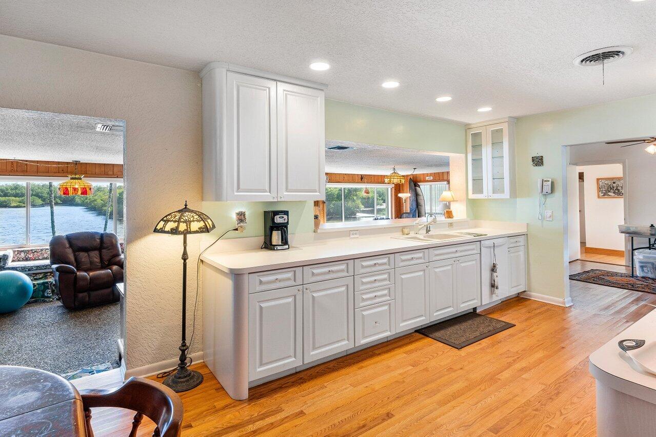 2 Inlet Cay Drive Ocean Ridge, FL 33435 - Photo 9 of 22 a kitchen with a sink appliances and cabinets