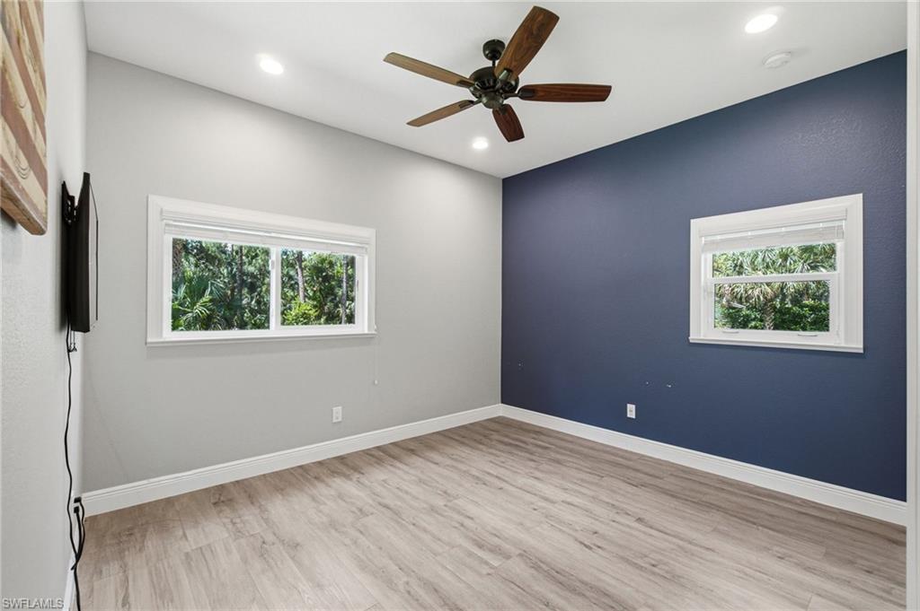2053 17th Street Southwest Naples, FL 34117 - Photo 33 of 47 an empty room with a window and a ceiling fan