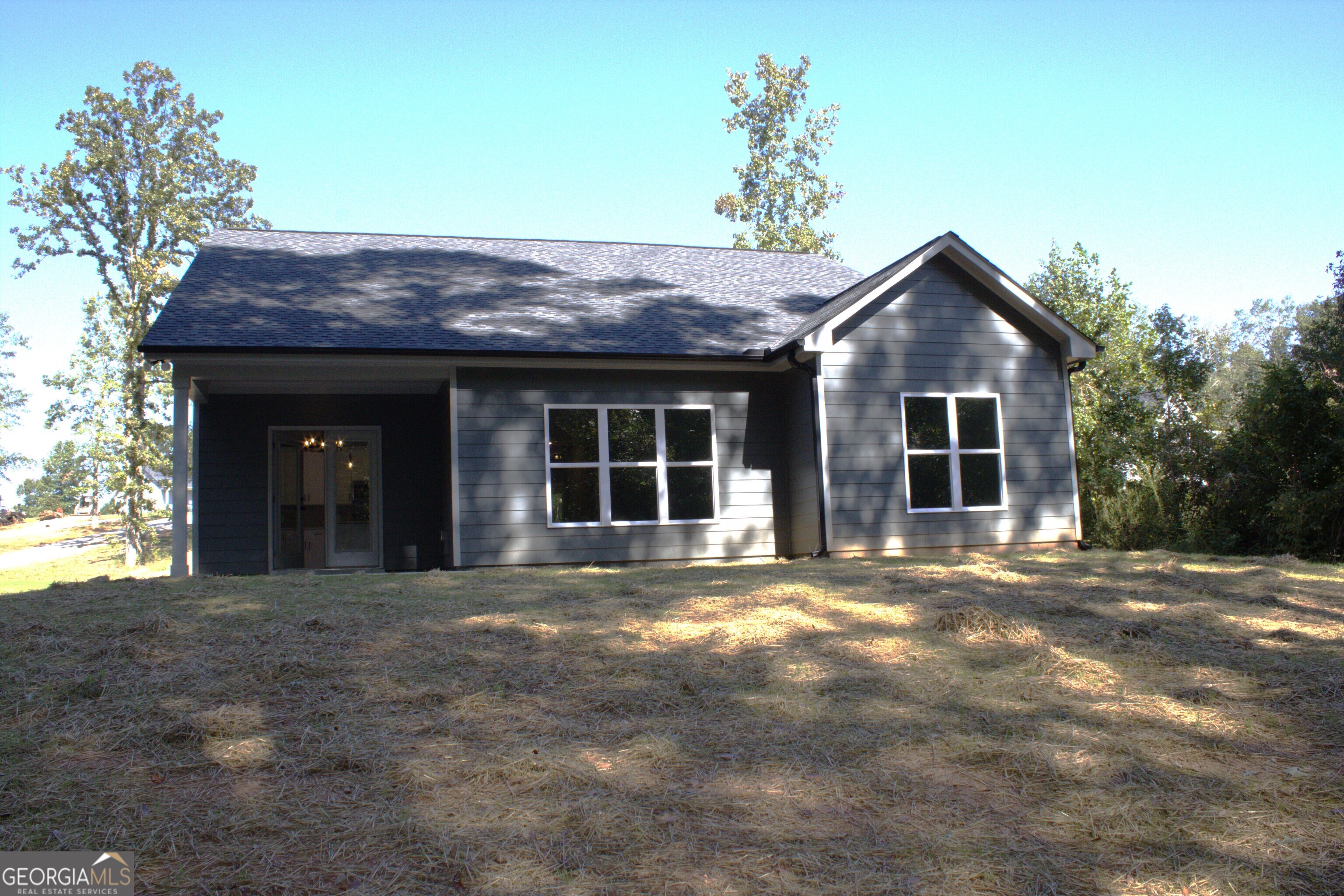 247 North Point Circle Hartwell, GA 30643 - Photo 2 of 18 a front view of a house with a garden