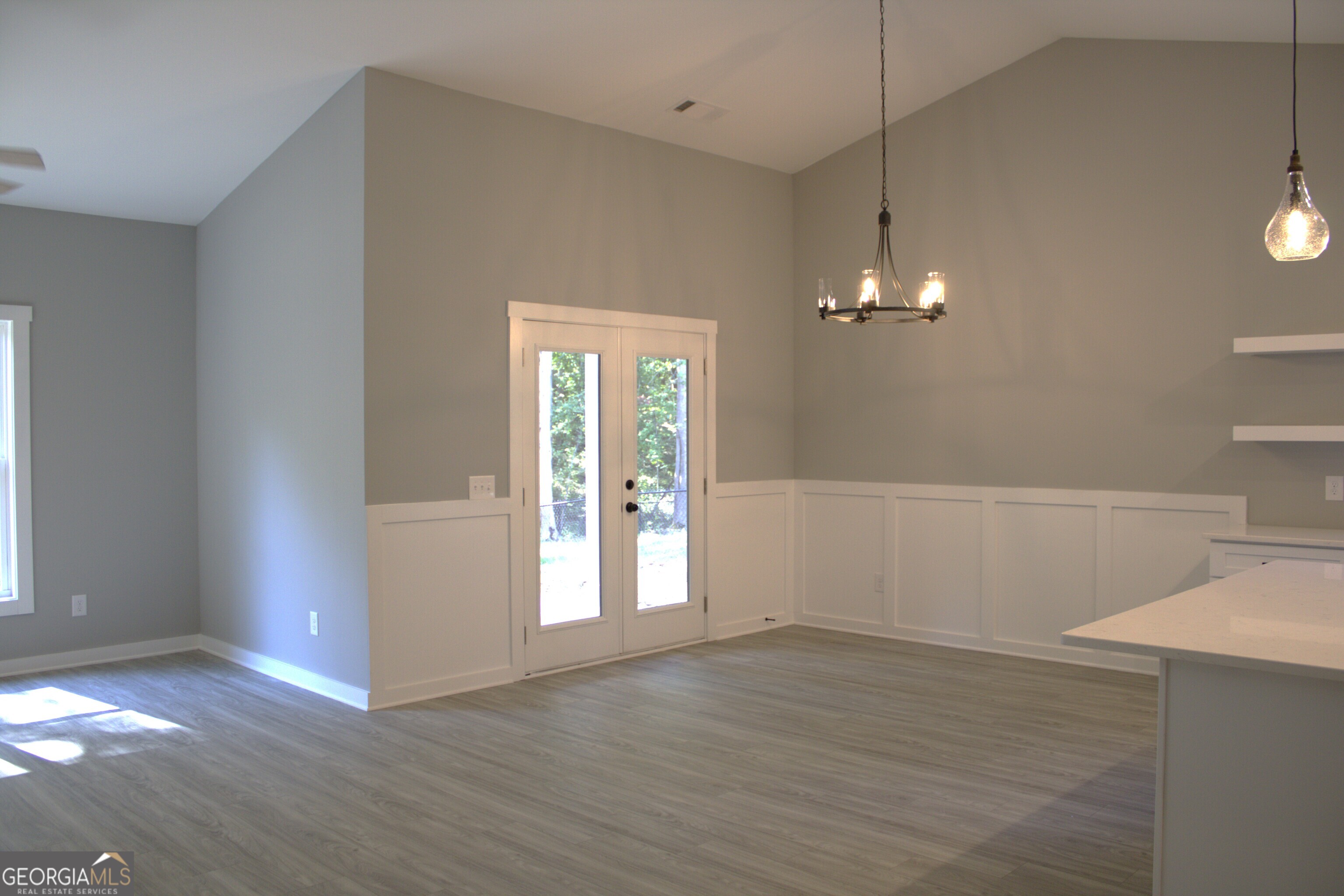 247 North Point Circle Hartwell, GA 30643 - Photo 8 of 18 an empty room with wooden floor and windows
