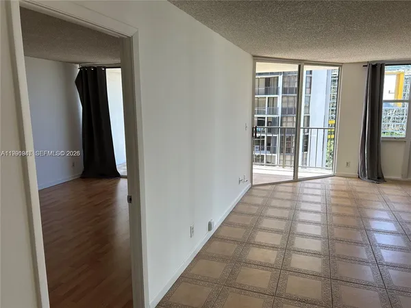a kitchen with a refrigerator and a sink