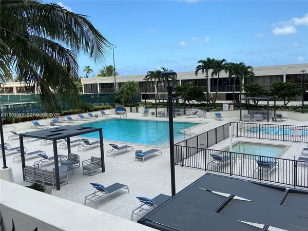 a view of a swimming pool with a patio