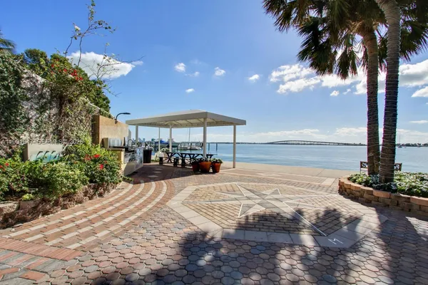a view of a hallway with wooden floor and stairs