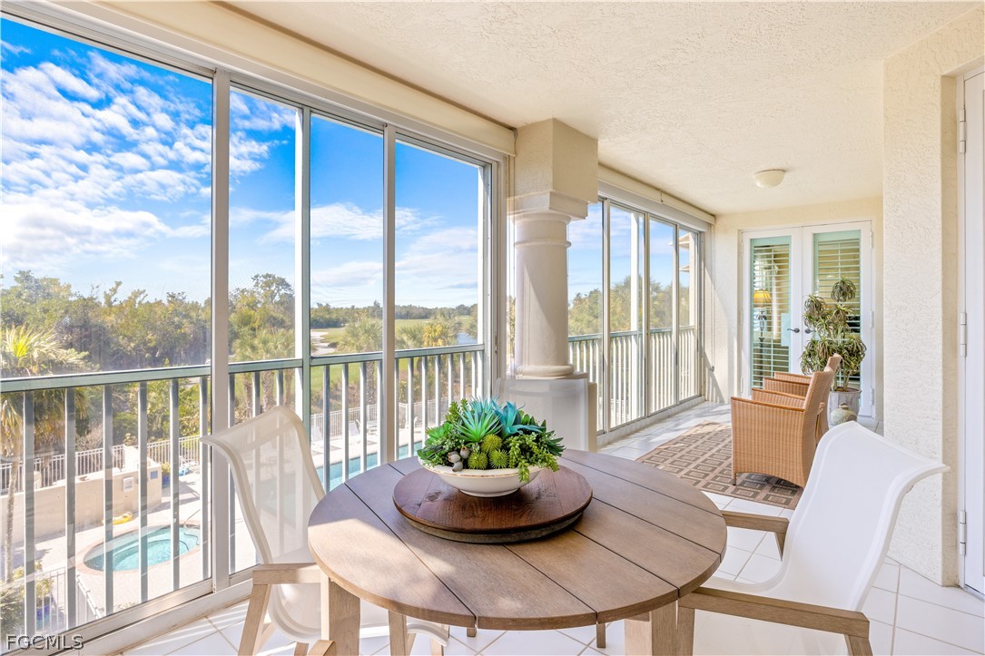 2619 Wulfert Road, Unit 3 Sanibel, FL 33957 - Photo 15 of 42 a view of a dining room with furniture window and wooden floor