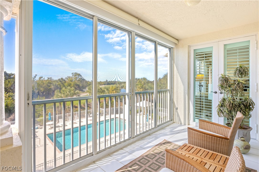 2619 Wulfert Road, Unit 3 Sanibel, FL 33957 - Photo 16 of 42 a view of a balcony with wooden floor