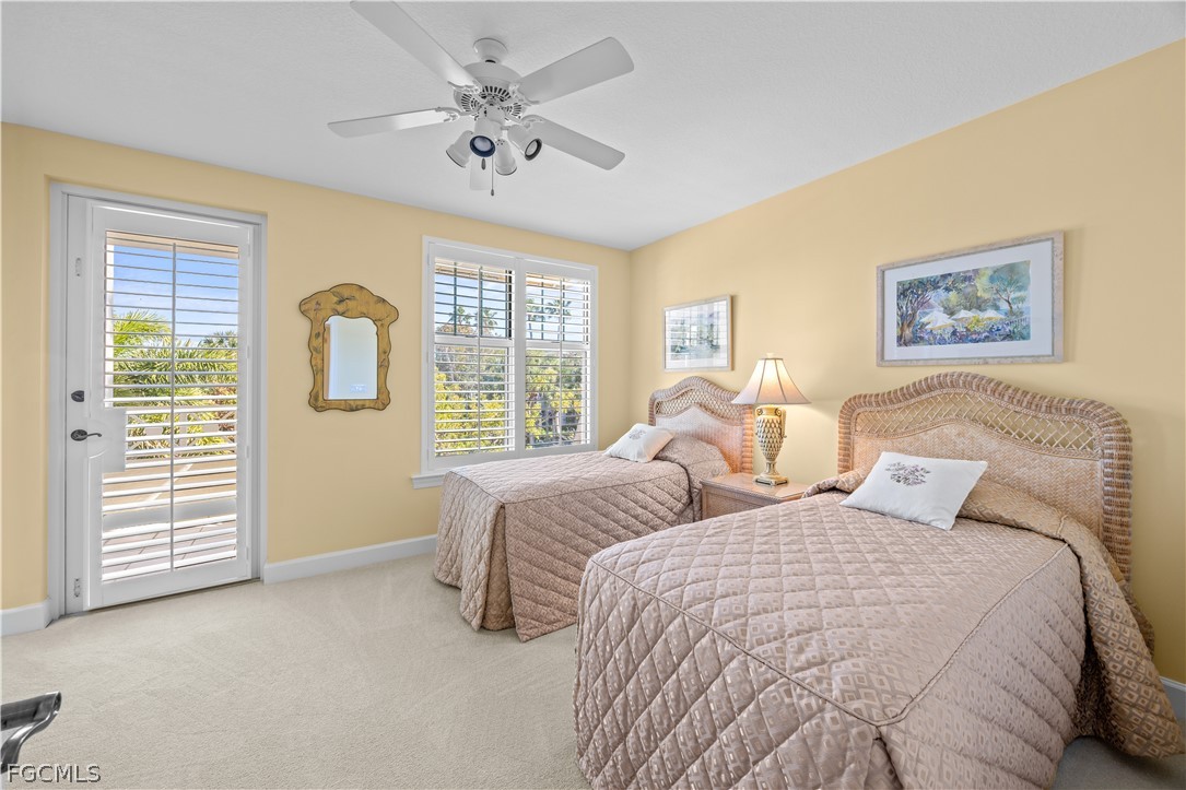 2619 Wulfert Road, Unit 3 Sanibel, FL 33957 - Photo 20 of 42 a bedroom with two beds and a window
