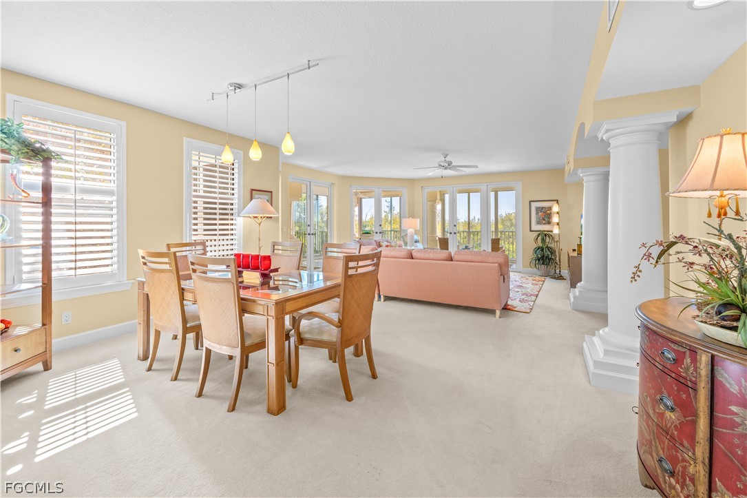 2619 Wulfert Road, Unit 3 Sanibel, FL 33957 - Photo 2 of 42 a dining room with furniture and a floor to ceiling window