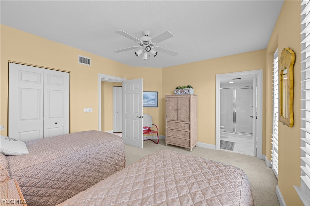 2619 Wulfert Road, Unit 3 Sanibel, FL 33957 - Photo 21 of 42 a bedroom with a bed and a walk in closet