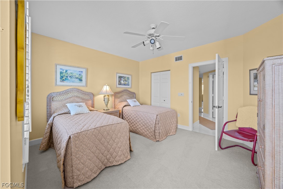 2619 Wulfert Road, Unit 3 Sanibel, FL 33957 - Photo 24 of 42 a spacious bedroom with two beds and painted walls