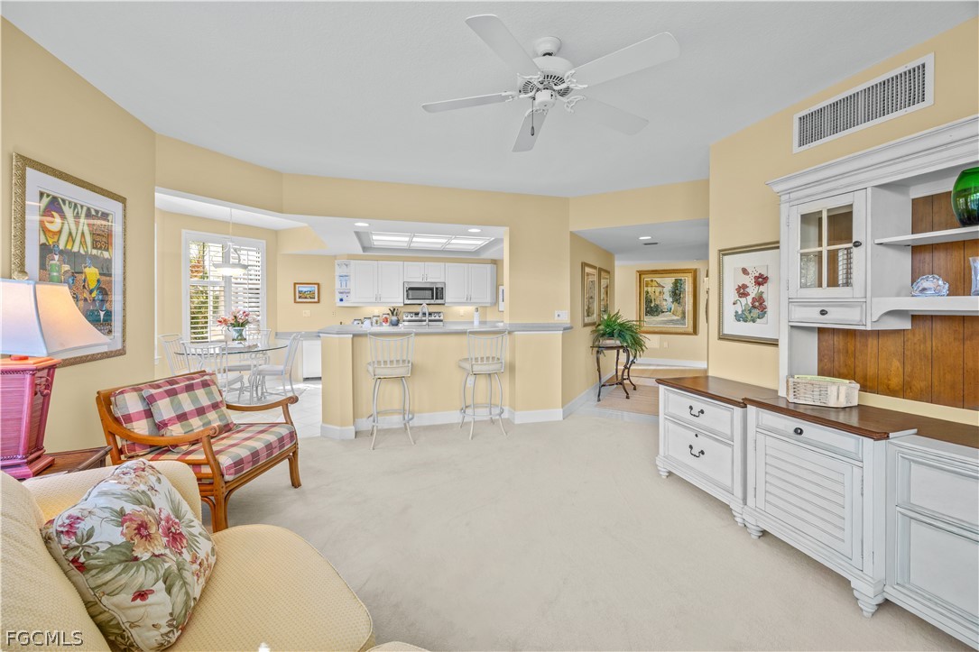 2619 Wulfert Road, Unit 3 Sanibel, FL 33957 - Photo 28 of 42 a large white kitchen with cabinets