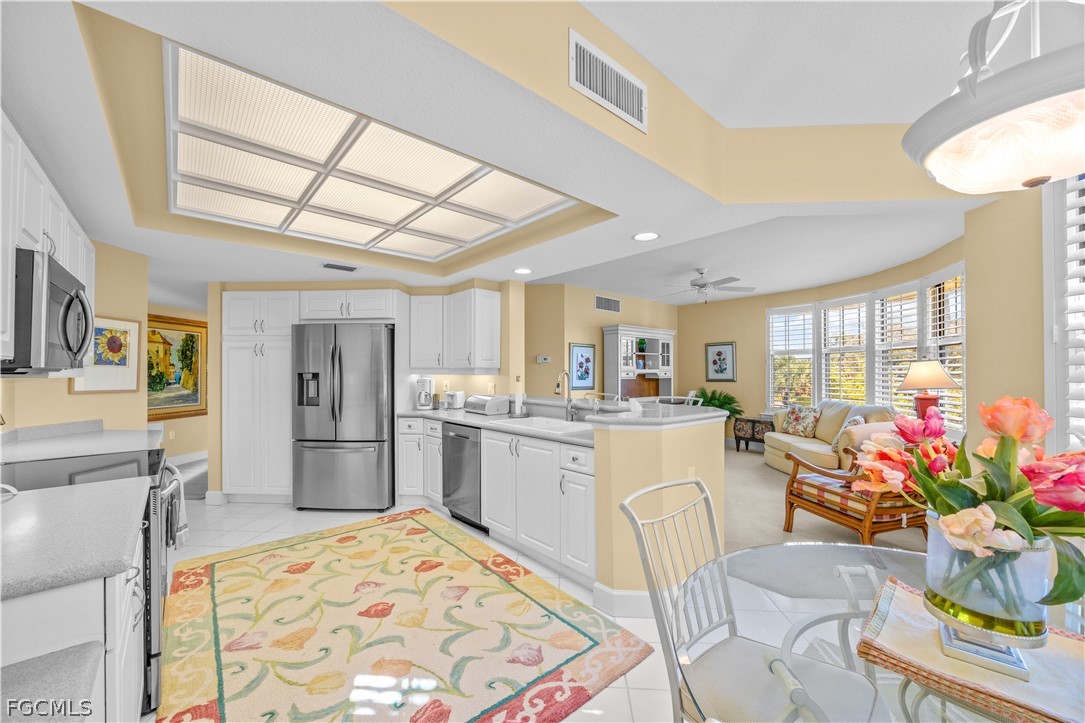 2619 Wulfert Road, Unit 3 Sanibel, FL 33957 - Photo 29 of 42 a kitchen with furniture and refrigerator