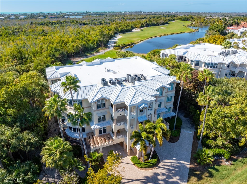 2619 Wulfert Road, Unit 3 Sanibel, FL 33957 - Photo 33 of 42 a view of a lake with a building in the background