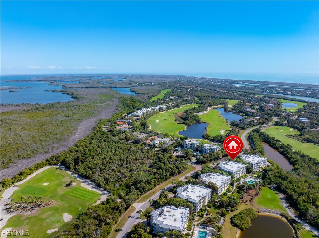 2619 Wulfert Road, Unit 3 Sanibel, FL 33957 - Photo 38 of 42 an aerial view of swimming pool a yard and mountain view in back