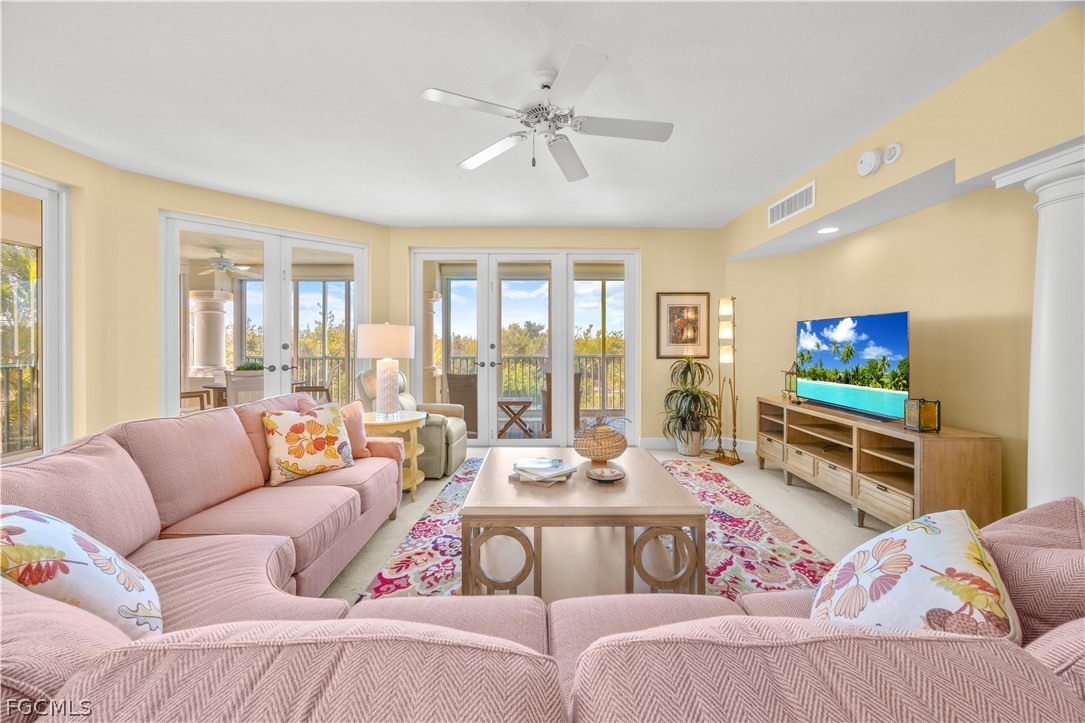 2619 Wulfert Road, Unit 3 Sanibel, FL 33957 - Photo 4 of 42 a living room with furniture and a flat screen tv