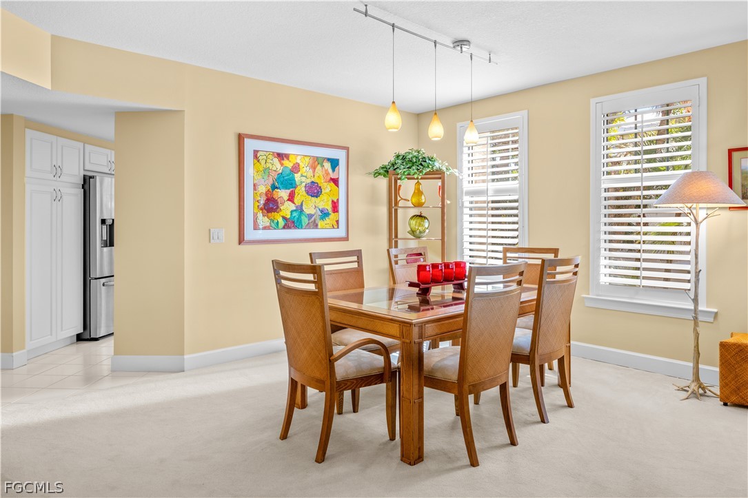 2619 Wulfert Road, Unit 3 Sanibel, FL 33957 - Photo 6 of 42 a dining room with furniture and window
