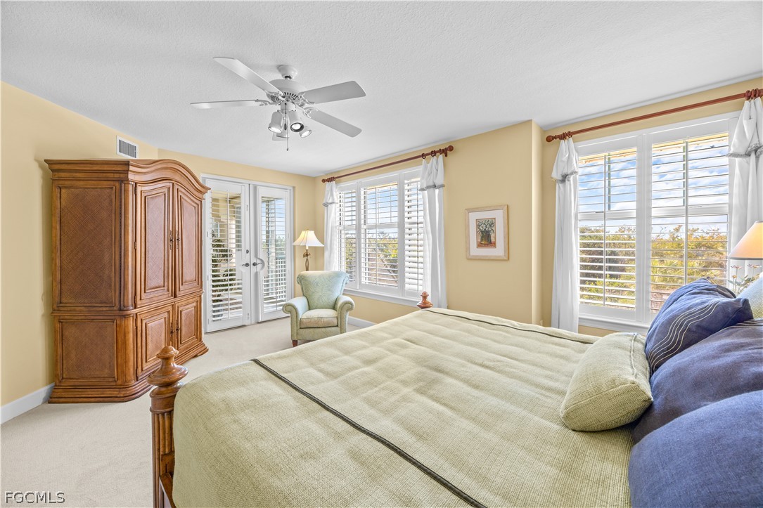 2619 Wulfert Road, Unit 3 Sanibel, FL 33957 - Photo 8 of 42 a bedroom with a bed and large window